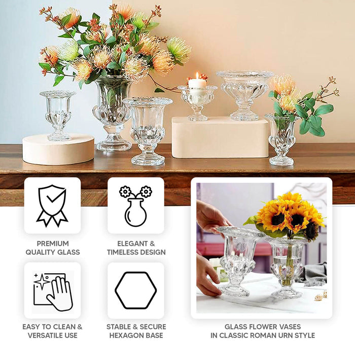 Elegant glass flower vases in classic Roman urn style with floral arrangement.