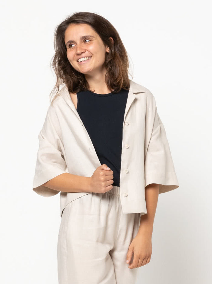 Albie Woven Shirt Multi-Size Sewing Pattern - PrintedAlbie Shirt Sewing Pattern with front, back, and side views, showcasing a box-shaped body, dropped shoulder, and square-shaped elbow-length sleeves with wide hems.