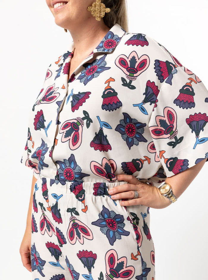 Albie Woven Shirt Multi-Size Sewing Pattern - PrintedAlbie Shirt Sewing Pattern with front, back, and side views, showcasing a box-shaped body, dropped shoulder, and square-shaped elbow-length sleeves with wide hems.