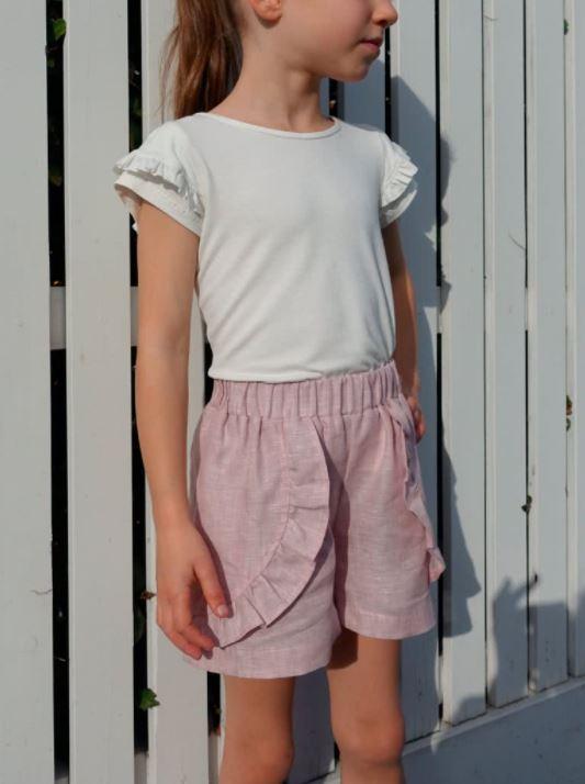 Alice Kids Short sewing pattern with options for a front overlay and frill, showcasing the design’s versatility and charm for children’s clothing.