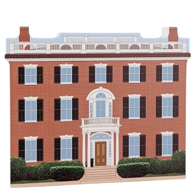 A wooden block featuring a two-story house with a front porch and columns, designed in the Federal style, with colorful details on the front.