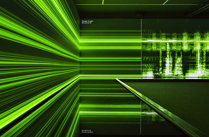 Book page with a photo of Bernie Krause sound waves in green