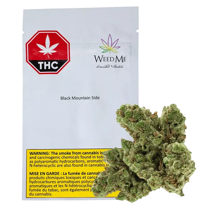 Front view of a white pouch labeled "Black Mountain Side" from WeedMe with a red THC octagon at top left and a cannabis bud placed in front.