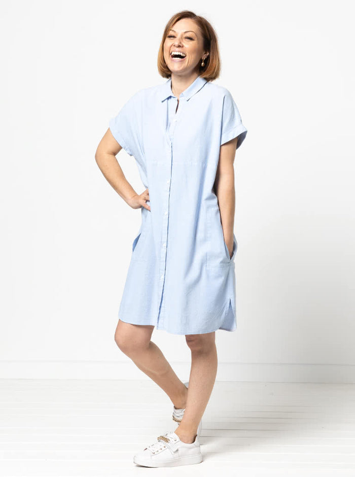 Lady wearing a blue dress made with the Blaire Dress Sewing Pattern – Shirtmaker style with shirt tail and inset pockets.