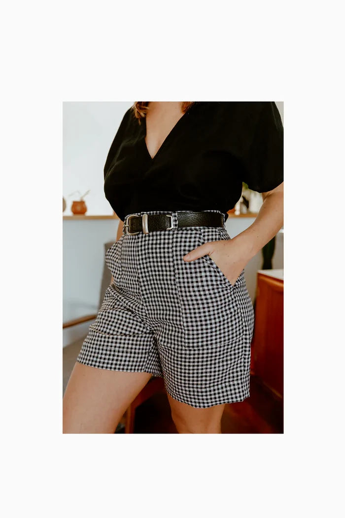 Lady wearing shorts  in blach gingham made of Bottlebrush Pants and Shorts Sewing Pattern - High-Waisted Flared Pants and Mini Shorts