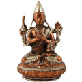 Bronze and silver brass statue of a seated Buddhist monk in meditative pose, hand-cast, close-up.