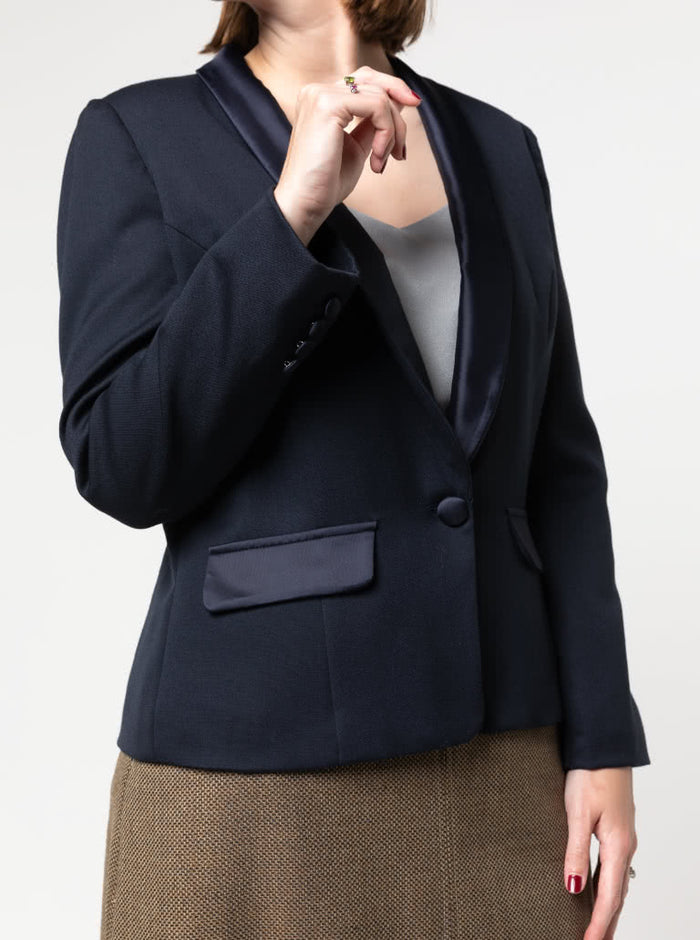 Navy blazer  made using the Bronnie Tuxedo Jacket Sewing pattern  worn by a person on a white background