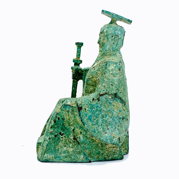 A bronze sculpture of a Qing Dynasty Emperor wearing a green and brown robe, seated on a throne with a textured patina to simulate antiquity.
