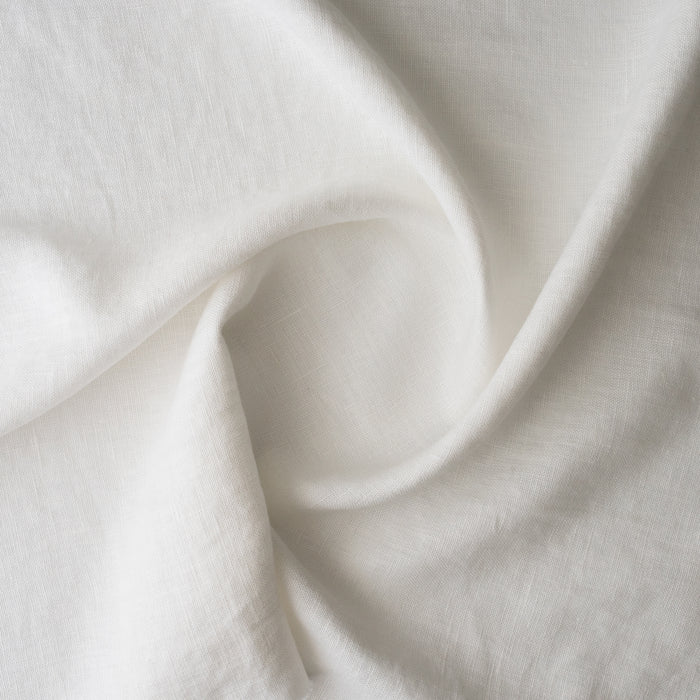 Close-up of Chalk White extra wide 280cm 100% linen fabric 300gsm for jackets, aprons, cushions, curtains and structured home textiles with soft folds