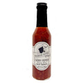 A jar of Cherry Pepper Shark Bait Hot Sauce with a label that includes the brand name and product description.