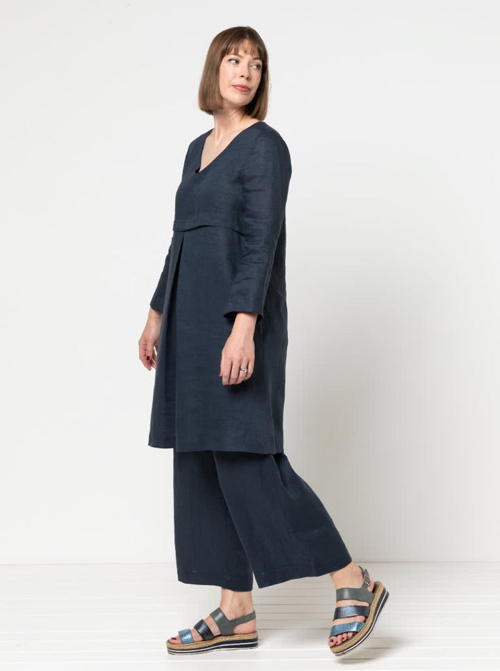 Clare Pant Sewing Pattern with wide leg, elastic waist, tie belt, angled pockets, and front pleats, perfect for fabrics like linen, crepe, or fine wool