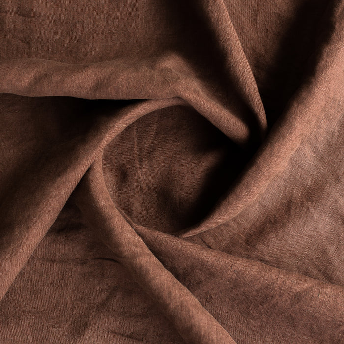 Close-up of Cocoa extra wide 100% linen fabric  with folds