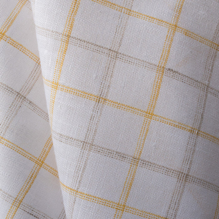 Creamy Lemon Oatmeal Check Linen Fabric, featuring sunshine yellow and earthy checks on white linen, with a fine weave for a soft feel and elegant drape..