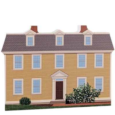 Decorative wood block of the Crowninshield-Bentley House with informative text on the reverse.