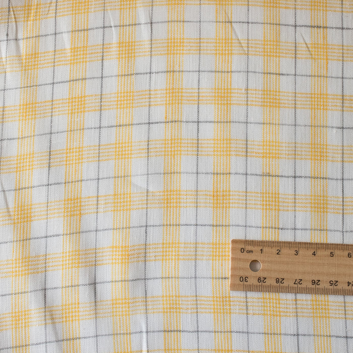 Summery Daffodil Check Linen Fabric with yellow and grey checks, offering a lightweight and delicate slub texture for airy summer garments.