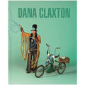 Cover of the book featuring a person in an artistic performance setting, dressed in a headdress and holding a whip next to a bicycle, against a green background.