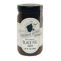 A glass jar with a black lid. The label reads 'Lighthouse Keepers Decadent Black Fig Jam'