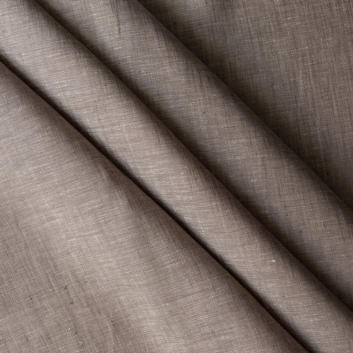 Close-up of Earthbound Chambray Linen fabric in a warm taupe stone shade, 100% linen, 145 GSM with chambray texture — close-up weave detail