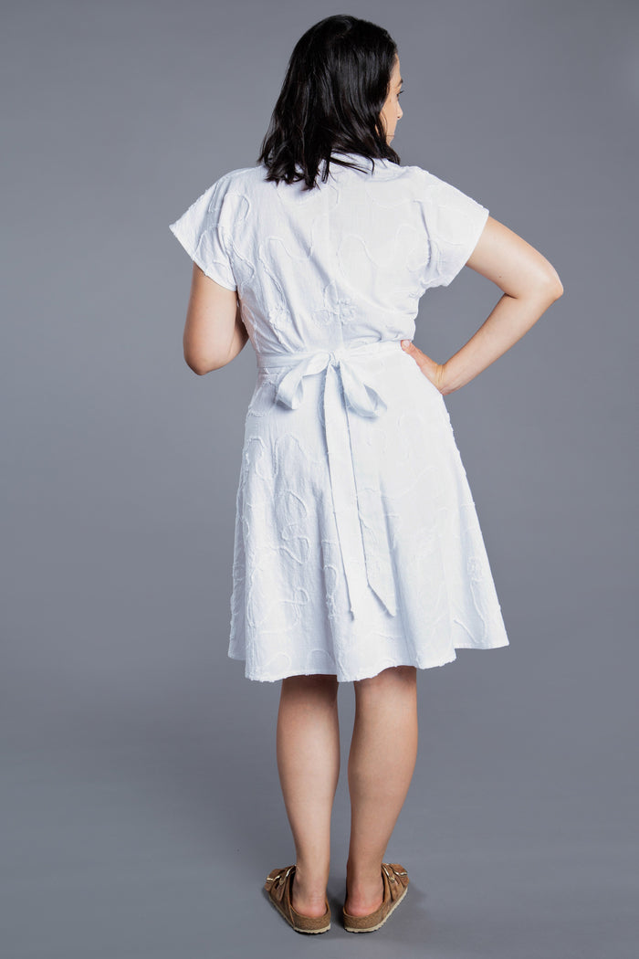 Charming Elodie Wrap Dress pattern with release pleats, dolman sleeves, and a choice of skirt lengths, perfect for any occasion from picnics to weddings