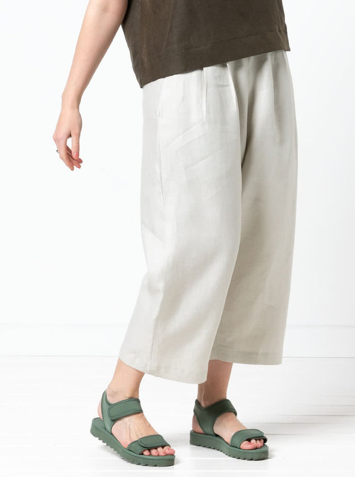 front view of Ethel Designer Pant sewing pattern by Style Arc, featuring elastic waist, dropped crotch, and balloon-shaped leg, suitable for linen, crepe, silk, and fine wool fabrics.
