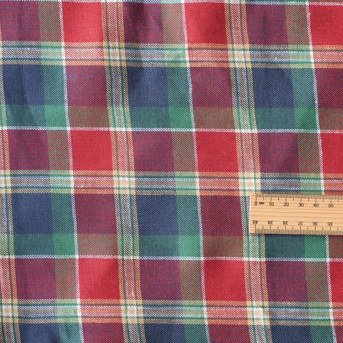 Plaid fabric with a ruler for scale- Festive Glen Tartan linen fabric – red, green and navy heritage tartan pattern, yarn-dyed linen for garments and festive sewing
