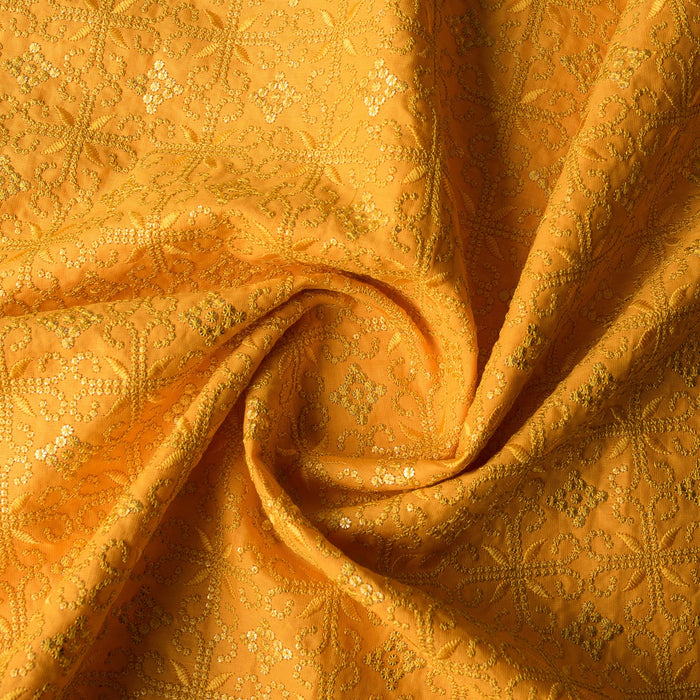 Luxurious golden mustard linen fabric with intricate embroidery and embellishments