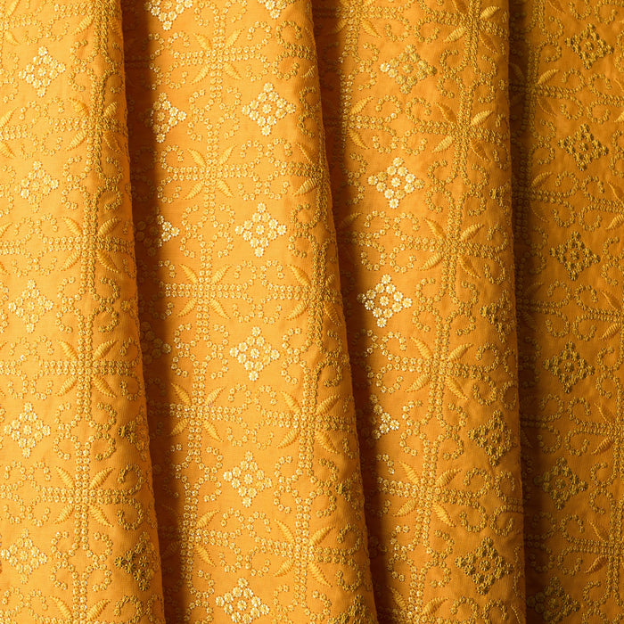 Luxurious golden mustard linen fabric with intricate embroidery and embellishments