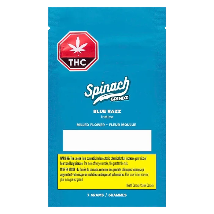 Centered front view of the bright blue package labeled Grindz - Blue Razz with the Spinach logo, THC octagon, and a yellow health warning box.