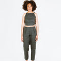 Guise Pants sewing pattern, featuring inverted pleats, zip fly, front and back pockets, and elasticated back, ideal for mid-weight woven fabrics like cotton, silk, and rayon.