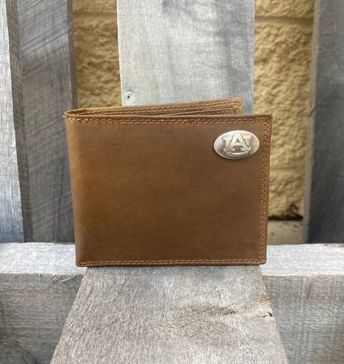 Zep-Pro Auburn University Brown “Crazy Horse” Leather Bifold Wallet. 
with an "AU" logo brass concho on the top right.  Front view.