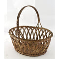 Close-up of a silver nickel wire woven oval basket with a single handle on a plain white background.