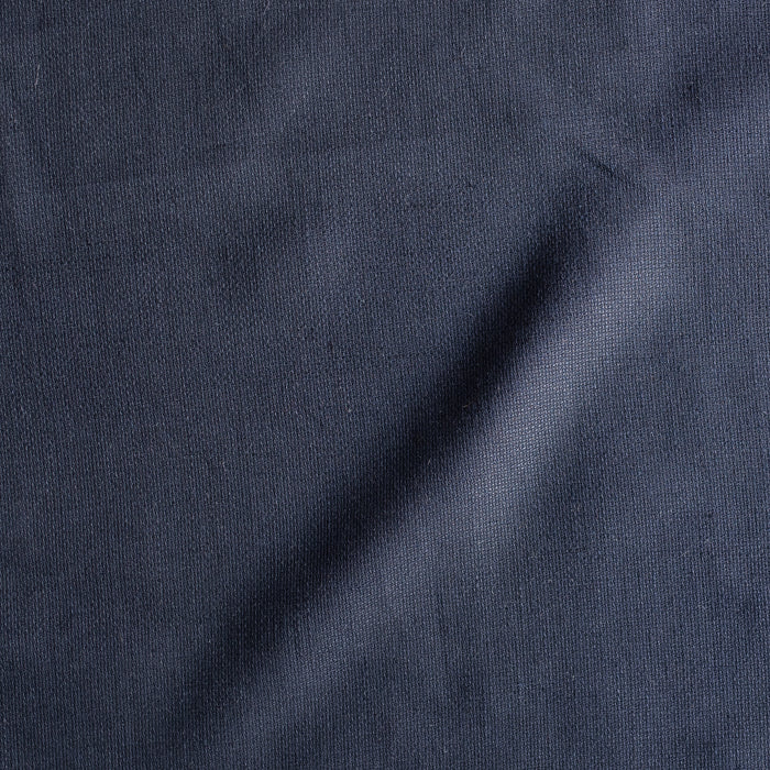 Ink navy linen fabric with visible yarn texture, slightly loose weave, suiting weight
