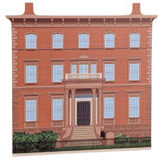 Decorative wood block of the John Tuck Daland House with informative text on the reverse.