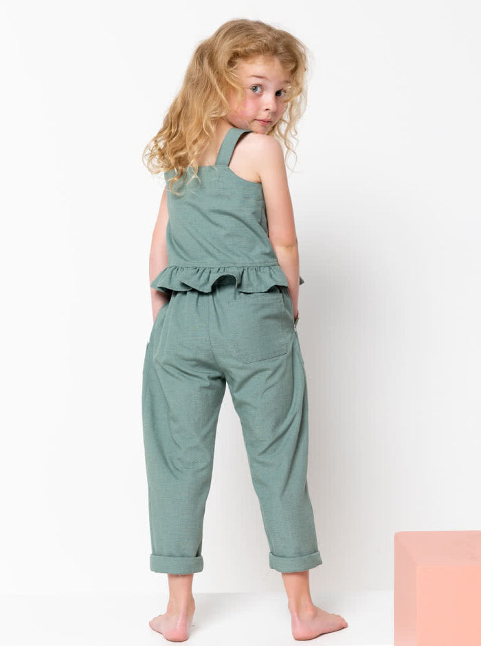 Kit Kids Tank Top sewing pattern, featuring a button-through top with frilled hem and adjustable shoulder straps for kids, suitable for linen, cotton, and denim fabrics.