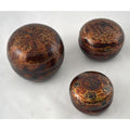 Set of 3 round brown lacquered jewelry boxes on white surface.