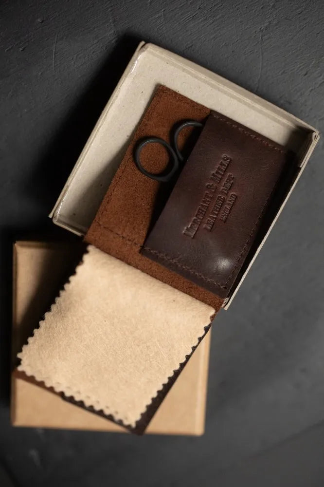 Merchant & Mills Leather Needle Wallet with premium needles and baby bow scissors for mending on the go
