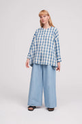 Leila Shirt sewing pattern, showcasing a loose-fitting, elegant design with dropped shoulders, full sleeves, and back gathering, suitable for a comfortable summer wardrobe.