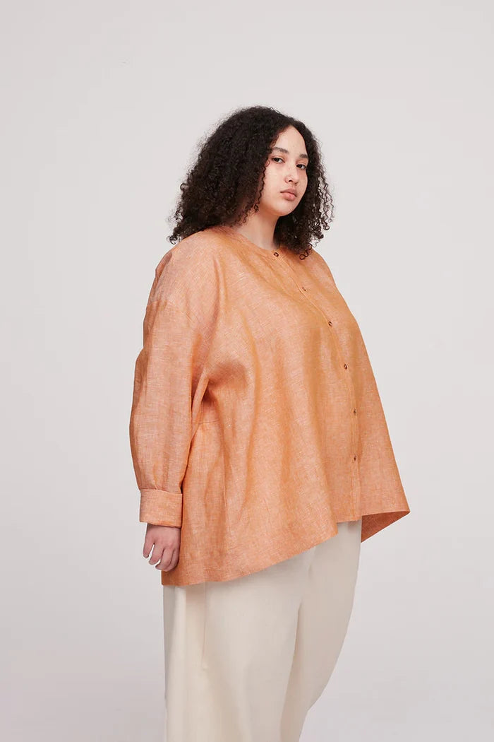 Leila Shirt sewing pattern, showcasing a loose-fitting, elegant design with dropped shoulders, full sleeves, and back gathering, suitable for a comfortable summer wardrobe.