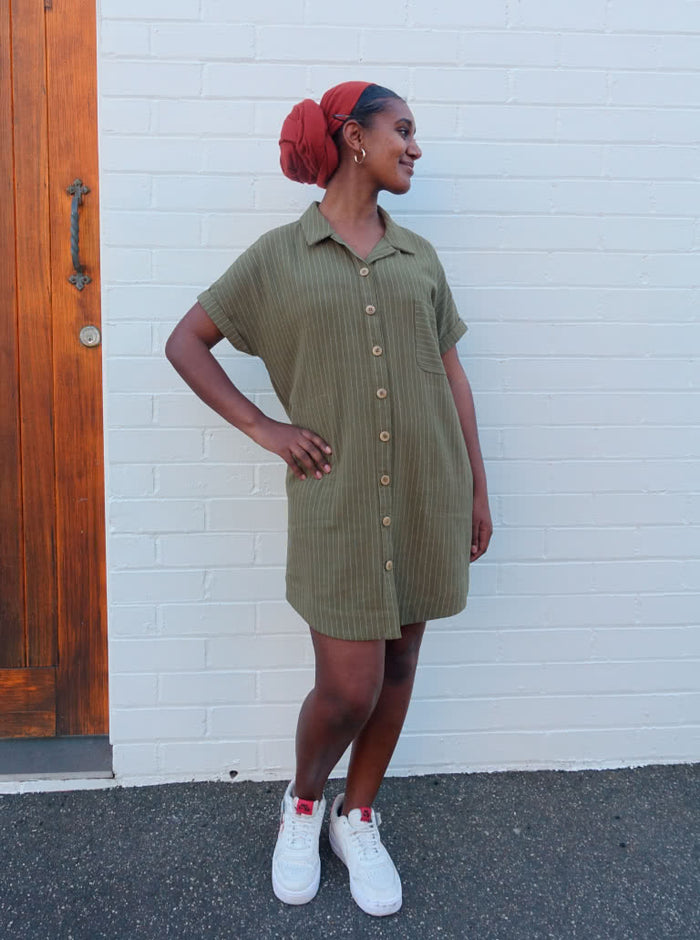 A modern Max tunic dress sewing pattern with dropped shoulders, a shaped hem, and inseam pockets, tailored for comfort and style in linen and other fabrics.