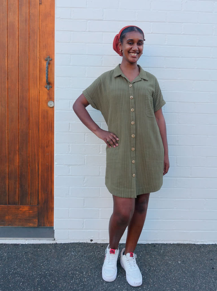 A modern Max tunic dress sewing pattern with dropped shoulders, a shaped hem, and inseam pockets, tailored for comfort and style in linen and other fabrics.