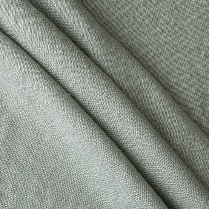 Close-up ofMisty Sage extra wide 280cm 100% linen fabric 300gsm for jackets, aprons, cushions, curtains and structured home textiles with folds
