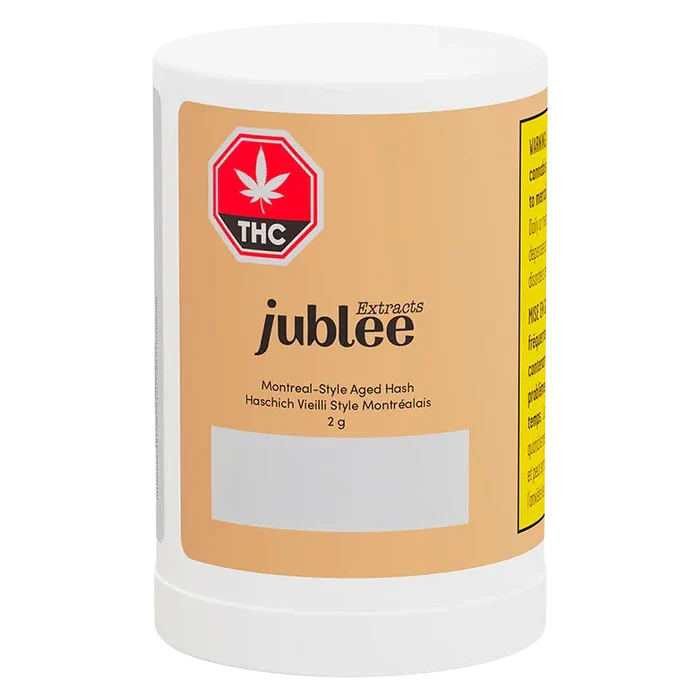 Front view of the Jubilee Extracts Montreal-Style Aged Hash white plastic jar with a tan label, THC emblem, and legible product text.