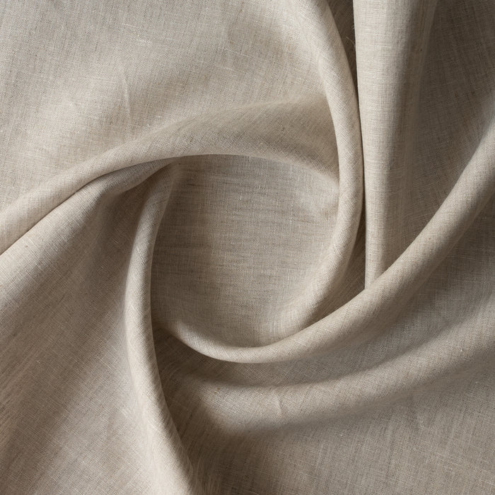 Close-up of natural linen fabric with folds