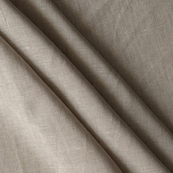 Close-up of beige fabric with a textured pattern