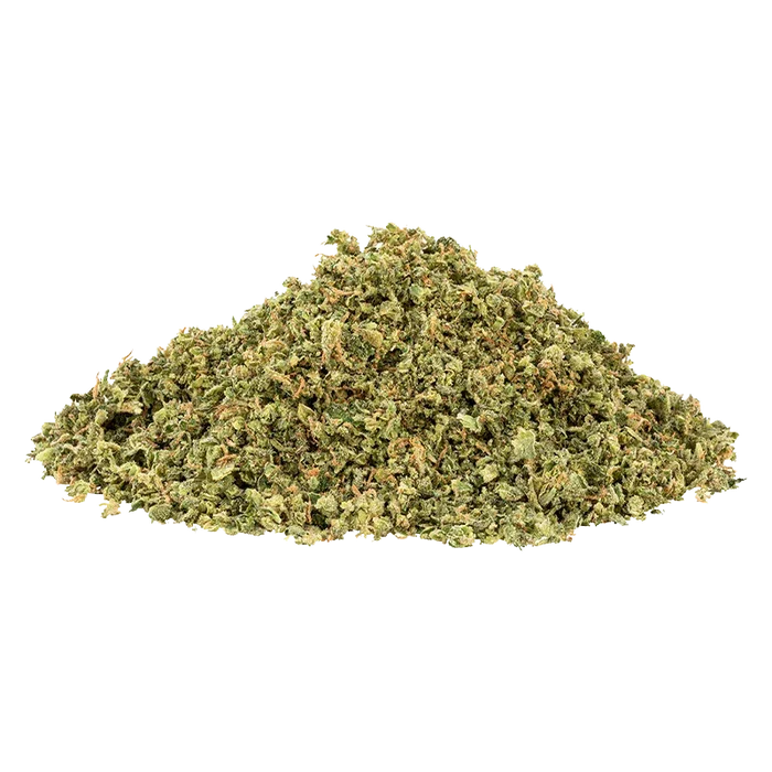 Pile of finely ground OG Rootbeer displayed against a white background, photographed from a low front angle showing texture and green-orange flecks