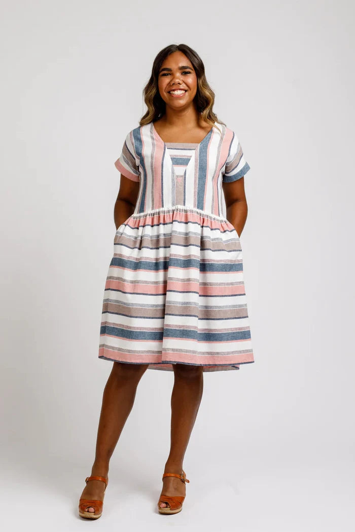 A relaxed silhouette Olive dress and top sewing pattern with a v-insert, drop shoulder, and multiple sleeve options, perfect for creating versatile garments.