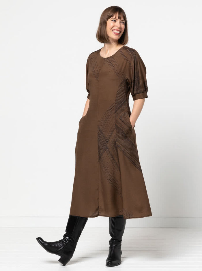 Elegant Penelope dress sewing pattern with a princess line, round neck, and unique elbow-length sleeves with tucks and gussets, suitable for silk, rayon, or linen