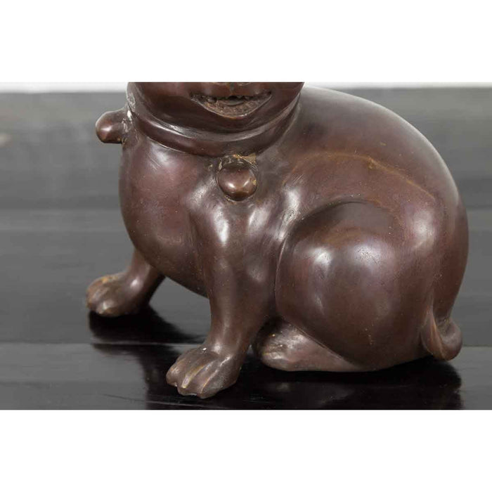 Bronze Taisho style Hirado puppy dog sculpture, petite size, shown seated from neck down, close-up view.