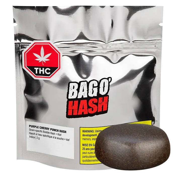 Front view of a silver pouch labeled "BAGO' HASH Purple Cherry Punch Hash" with a round dark hash resin puck displayed on the right.