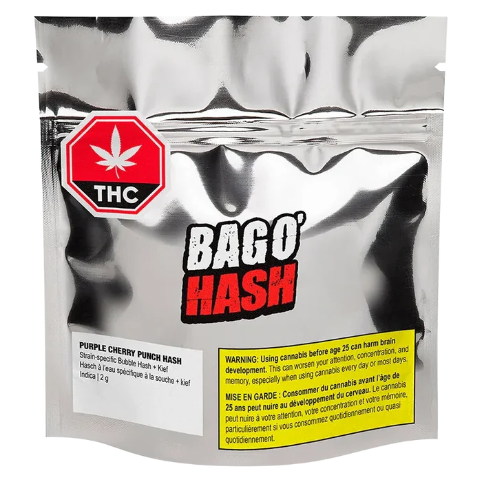 Front-facing shot of the metallic pouch labeled "BAGO' HASH Purple Cherry Punch Hash" with a red THC stop sign and yellow warning panel.